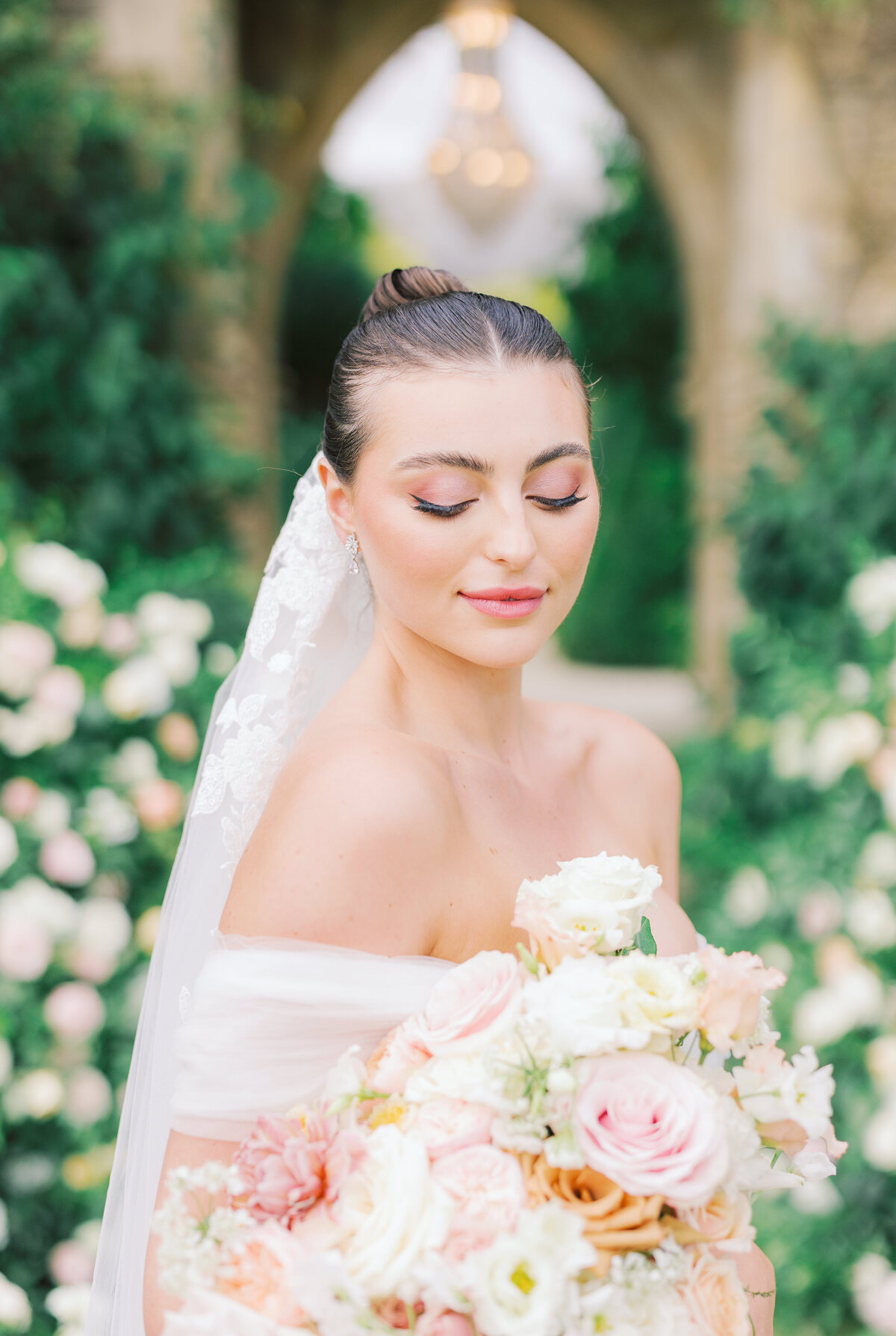 Bride looking at flowers