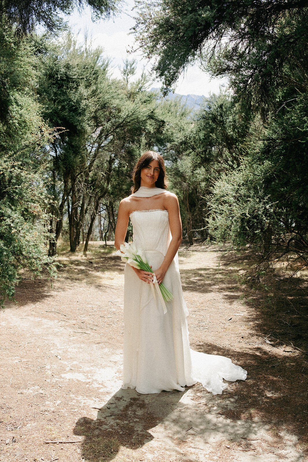 beautifulbrideonherweddingdayinqueenstownwithhairandmakeupnaturalandsoftfrommakeupartistpaigeshipstone19