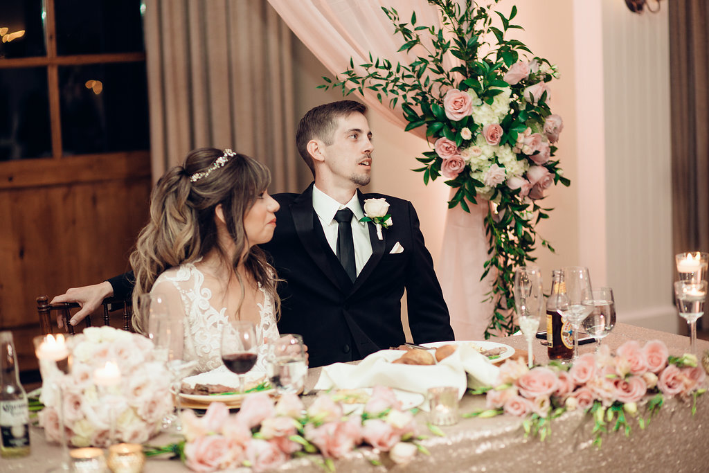 Wedding Photograph Of Bride And Groom Looking Up From Their Seats Los Angeles