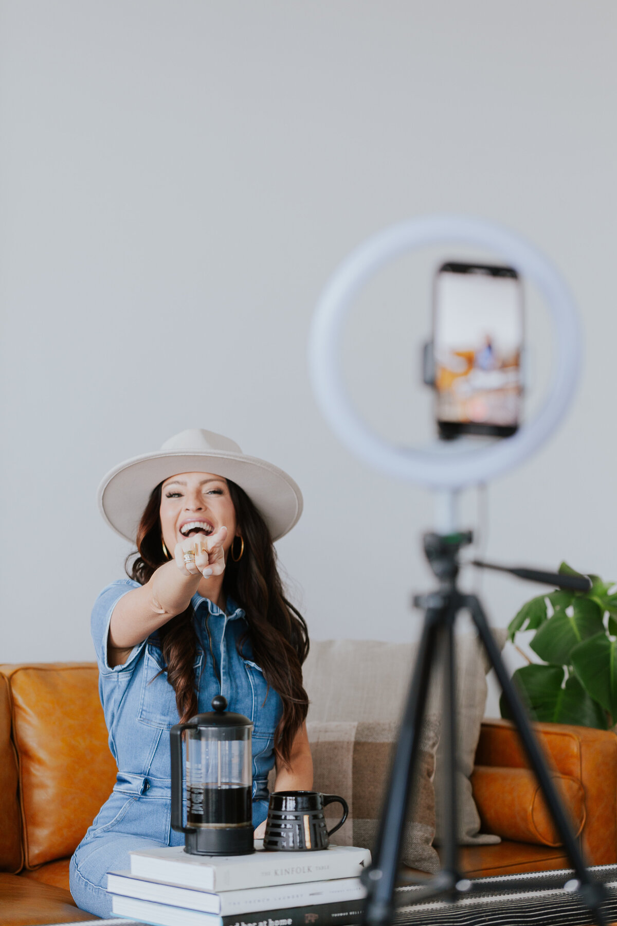 influencer-engaging-with-followers-filming-content-with-phone-and-ringlight-for-brand-session-the-frame-charlotte