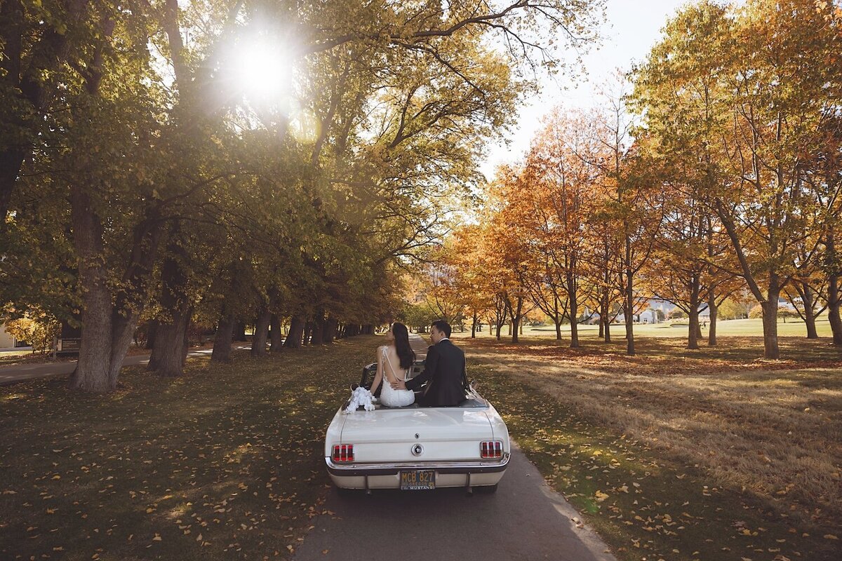Autumn wedding shoot at Millbrook, Arrowtown. Vintage car & helicopter.