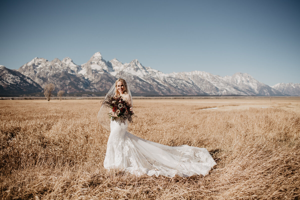 Jackson Hole Photographers capture bride in front of Tetons during bridal portraits