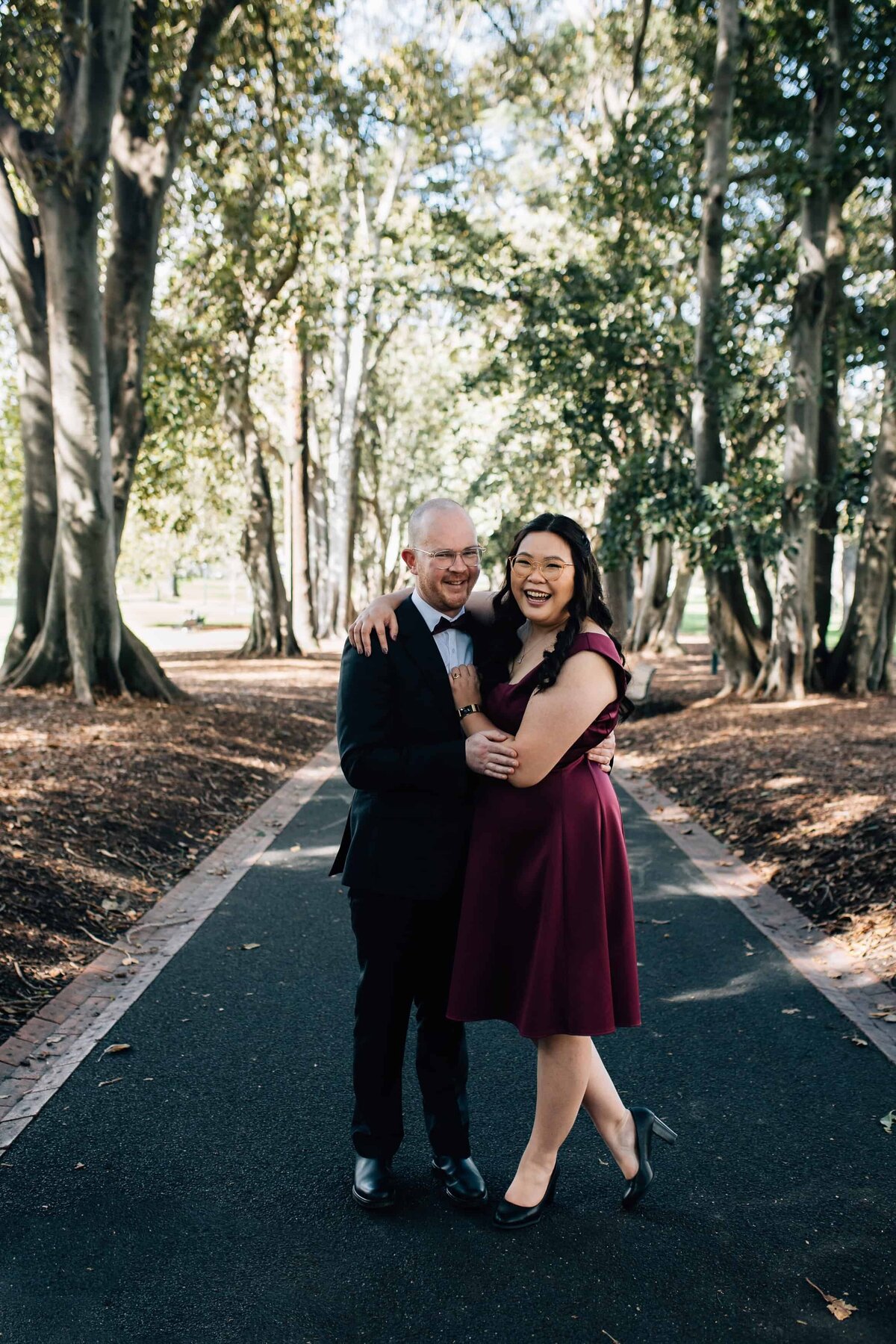 Couple hugging each other at wedding photoshoot in Treasury Gardens Melbourne, And So I Don't Forget Photography