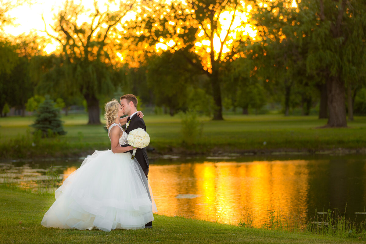 A sunset wedding photo taken next to a lake in Wicker Park.