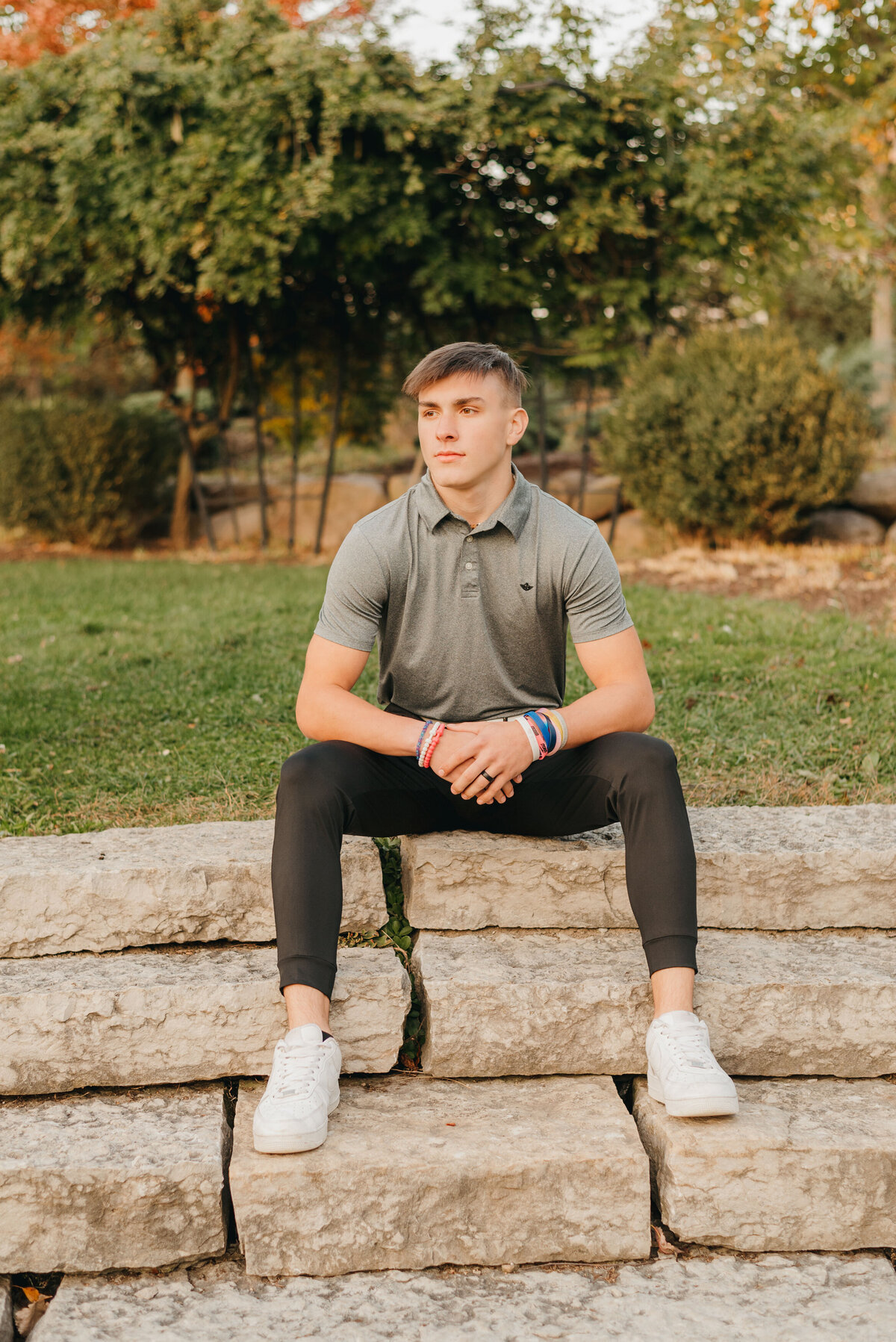 boy-sitting-near-trees