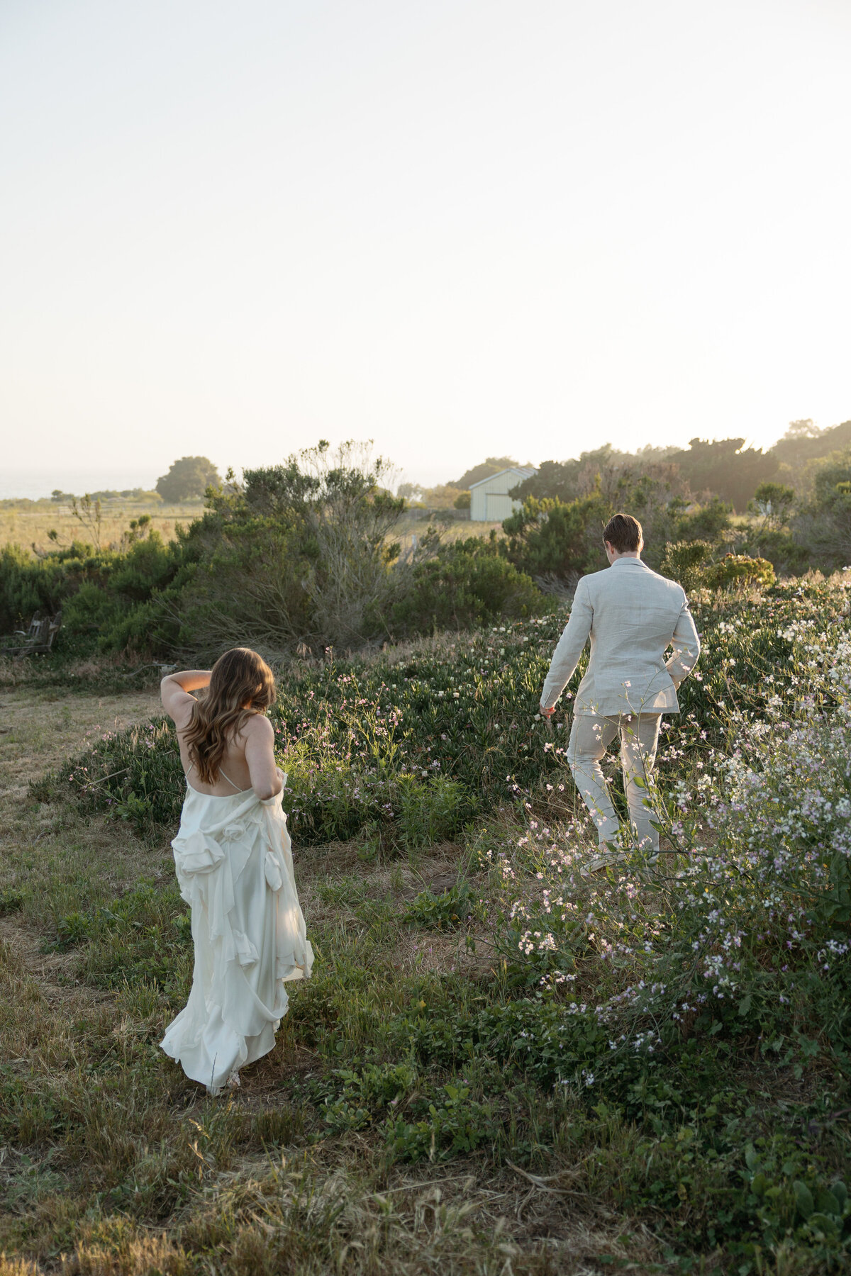 Romantic sunset portraits of the couple, showcasing their love against the breathtaking backdrop of the San Diego coastline in La Jolla.