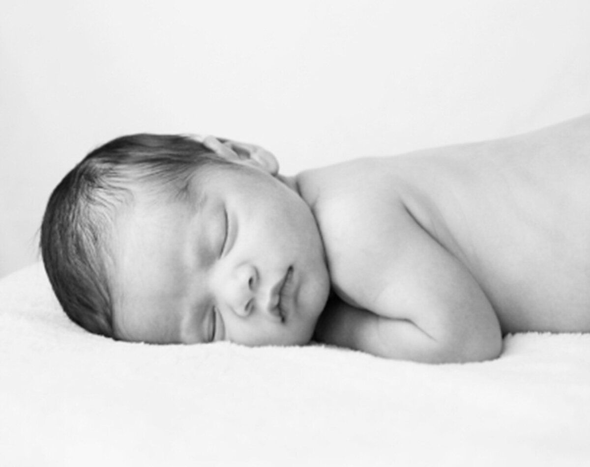 Natural newborn photography in San Francisco — baby resting peacefully during photo session