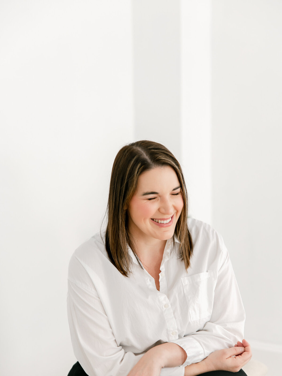woman laughing during portrait headshot session
