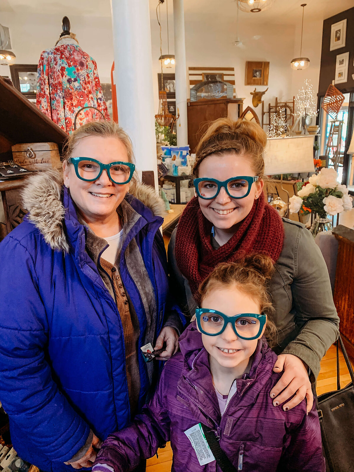 3 generations of women standing together with glasses