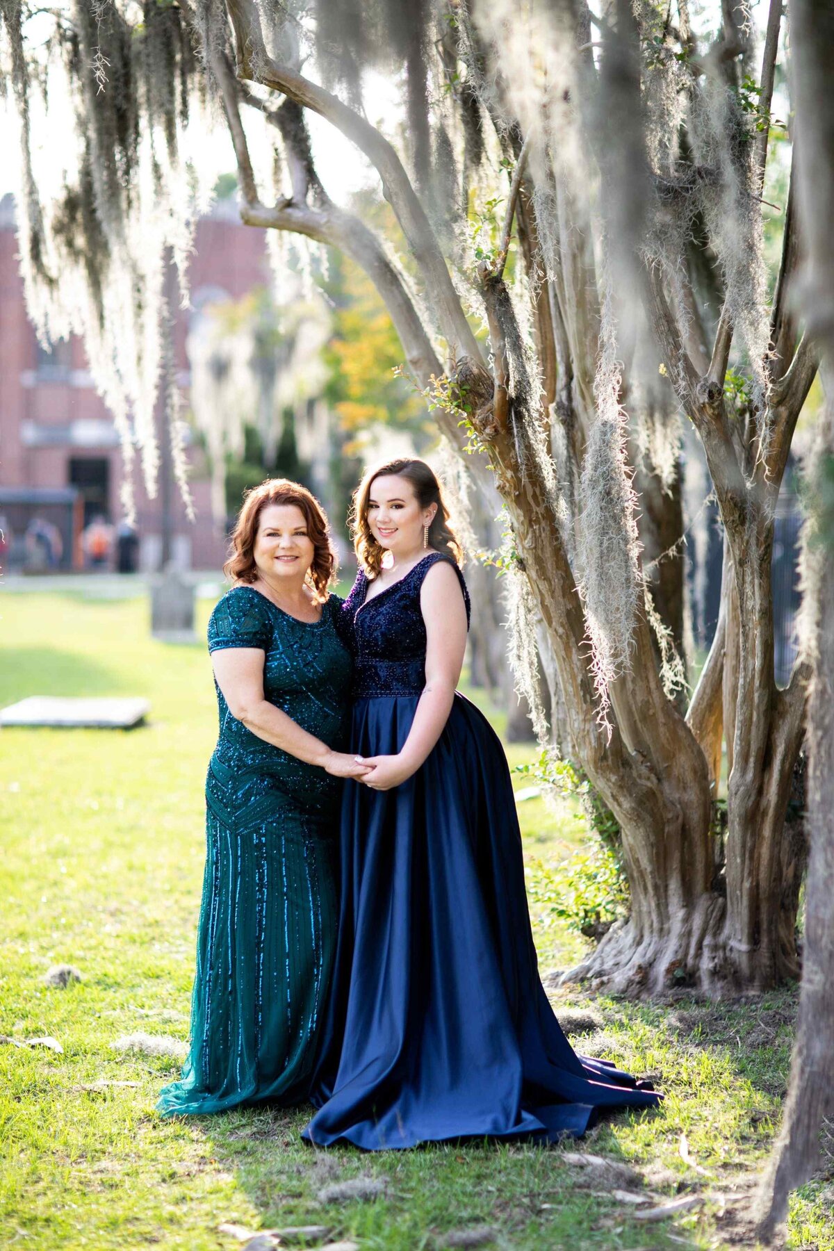 mother and daughter portrait under tree