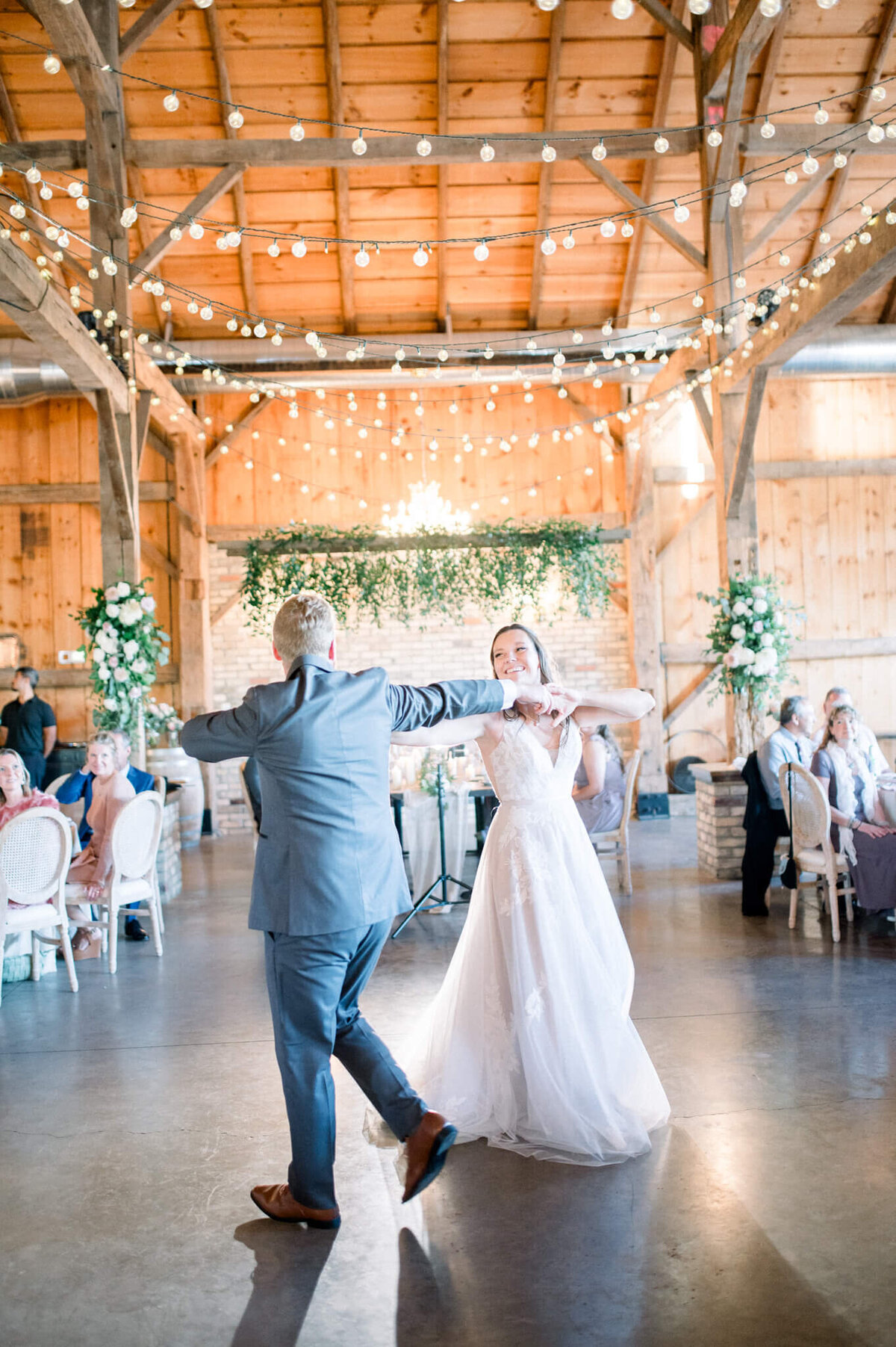 Bride and groom dance for their barn wedding in Toronto