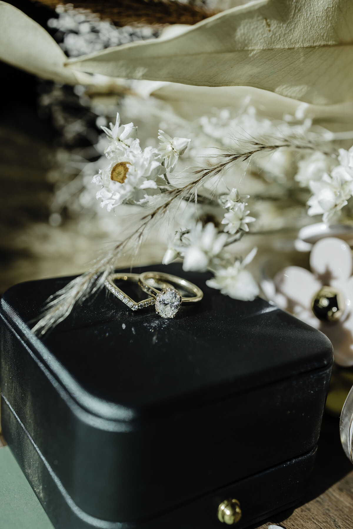 Brides ring on ring box with baby breath flowers