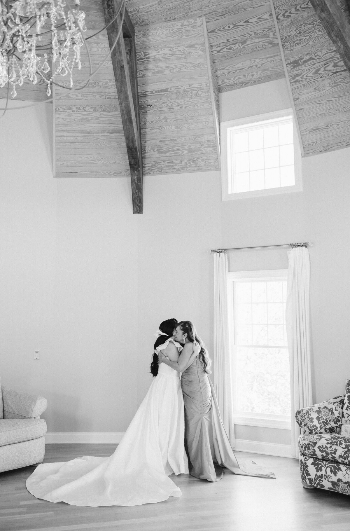 Mother of bride sharing  a hug with the bride