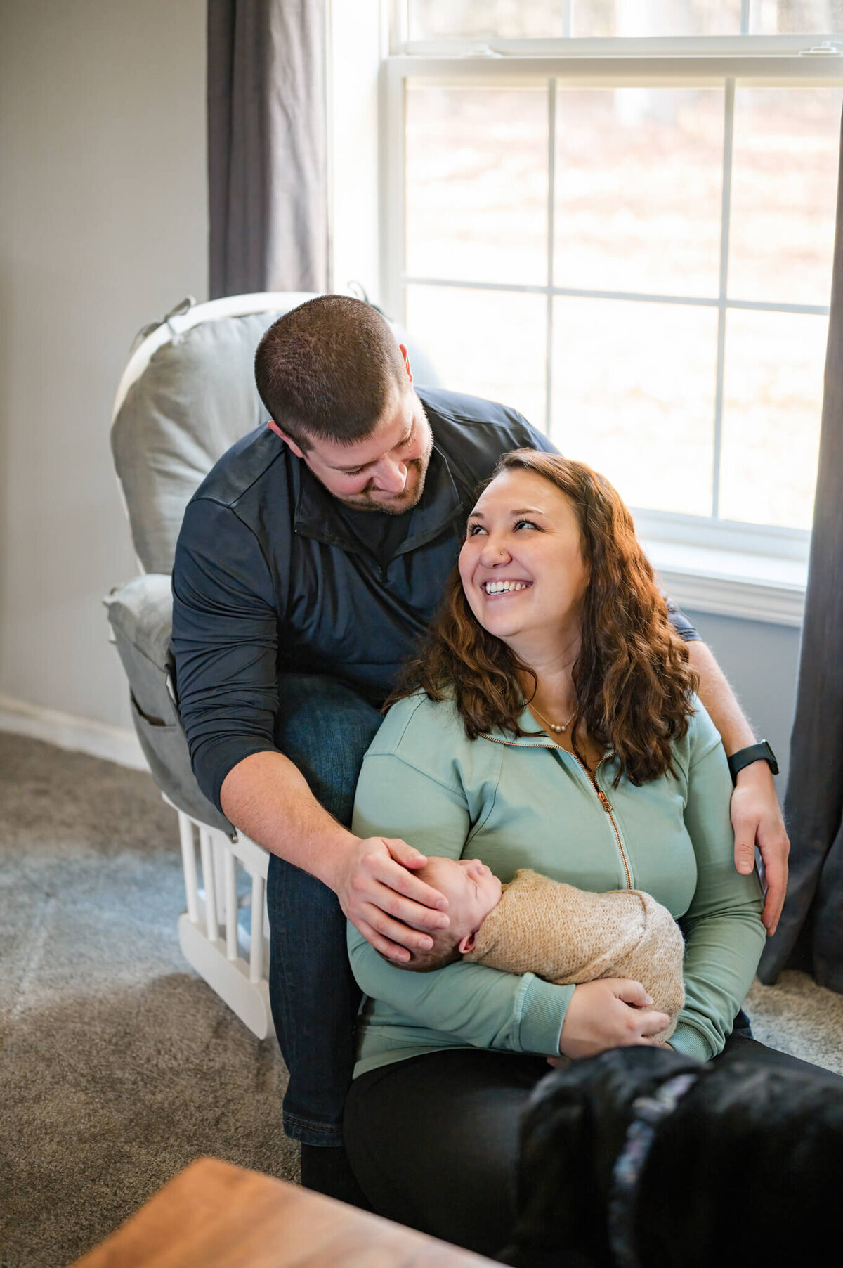 Mom and dad holding newborn