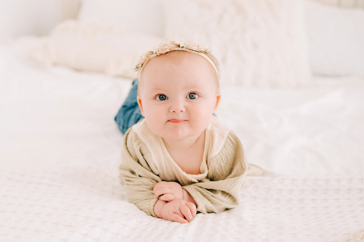 little girl pursing lips  captured by Branson MO baby photographer Jessica Kennedy of The XO Photography