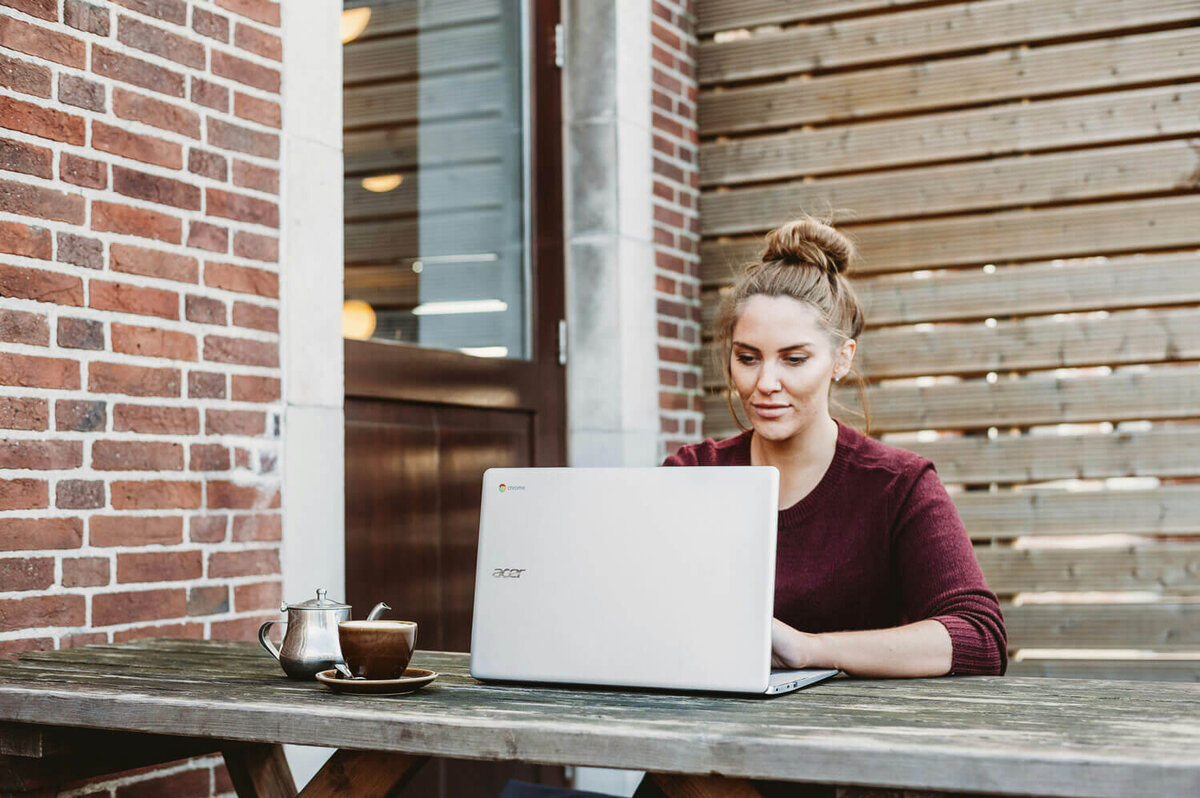 Real estate agent sitting at a computer