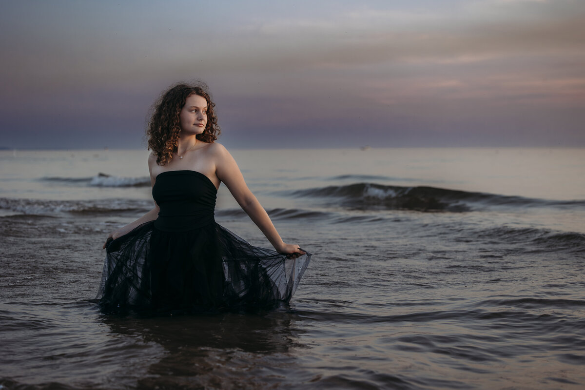Girl standing in Lake Michigan off of the Grand Haven Beach.