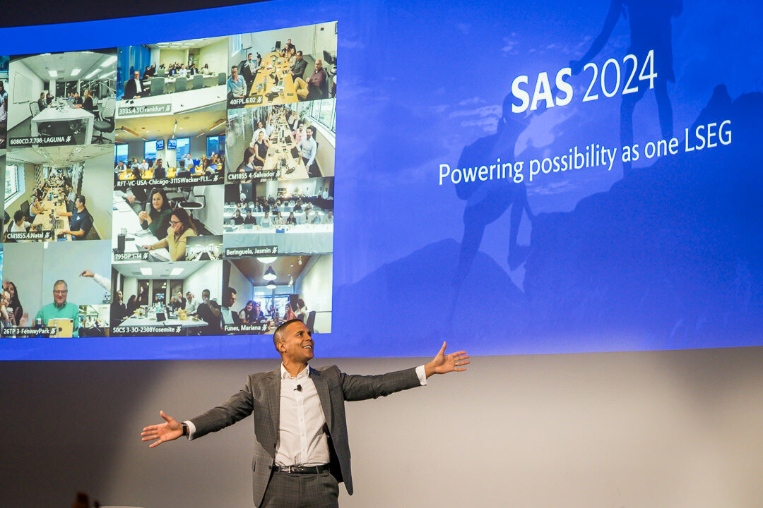 Corporate event photo of presenter on stage delivering business conference keynote new york.