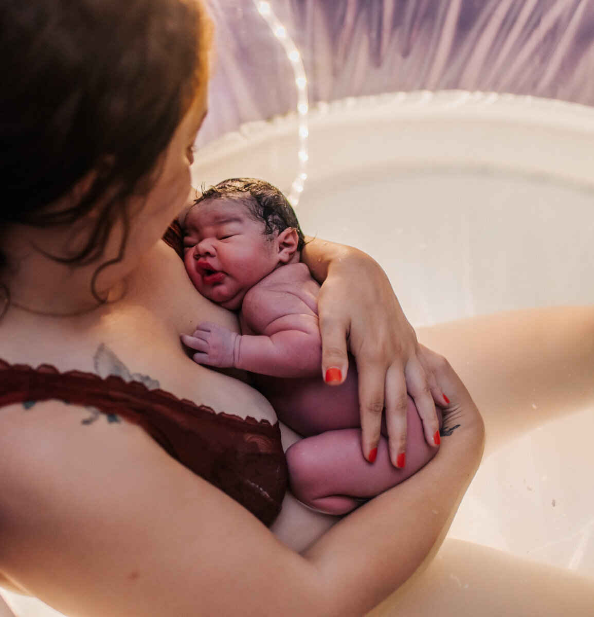 The moment when a mother holds her baby for the first time, capturing the deep connection and overwhelming joy that comes with new life.