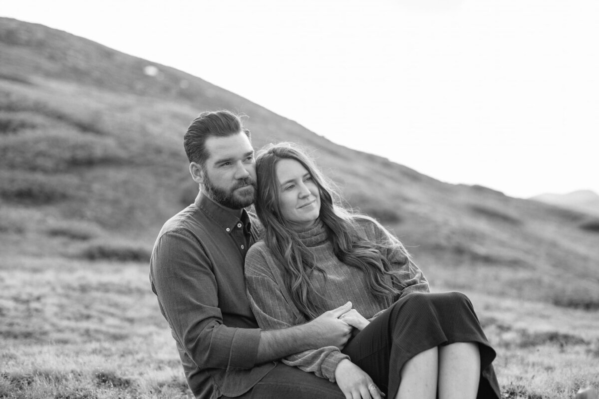 loving-couple-embracing-on-hillside