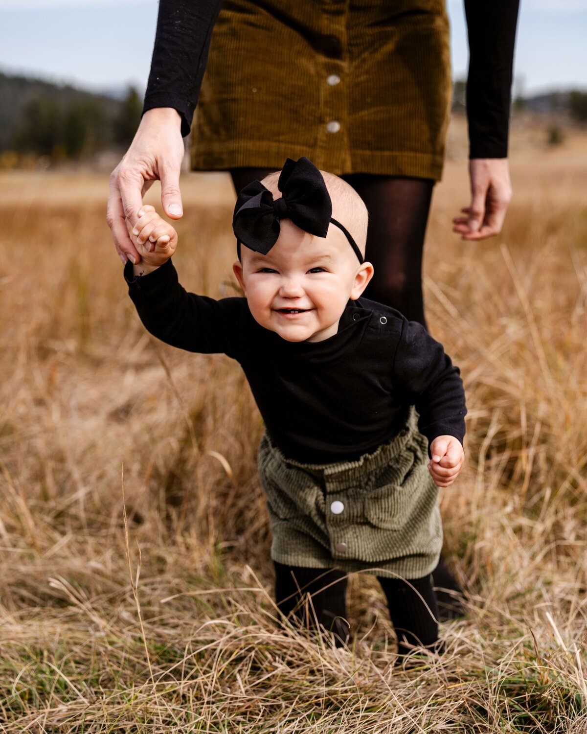 little girl standing in grass