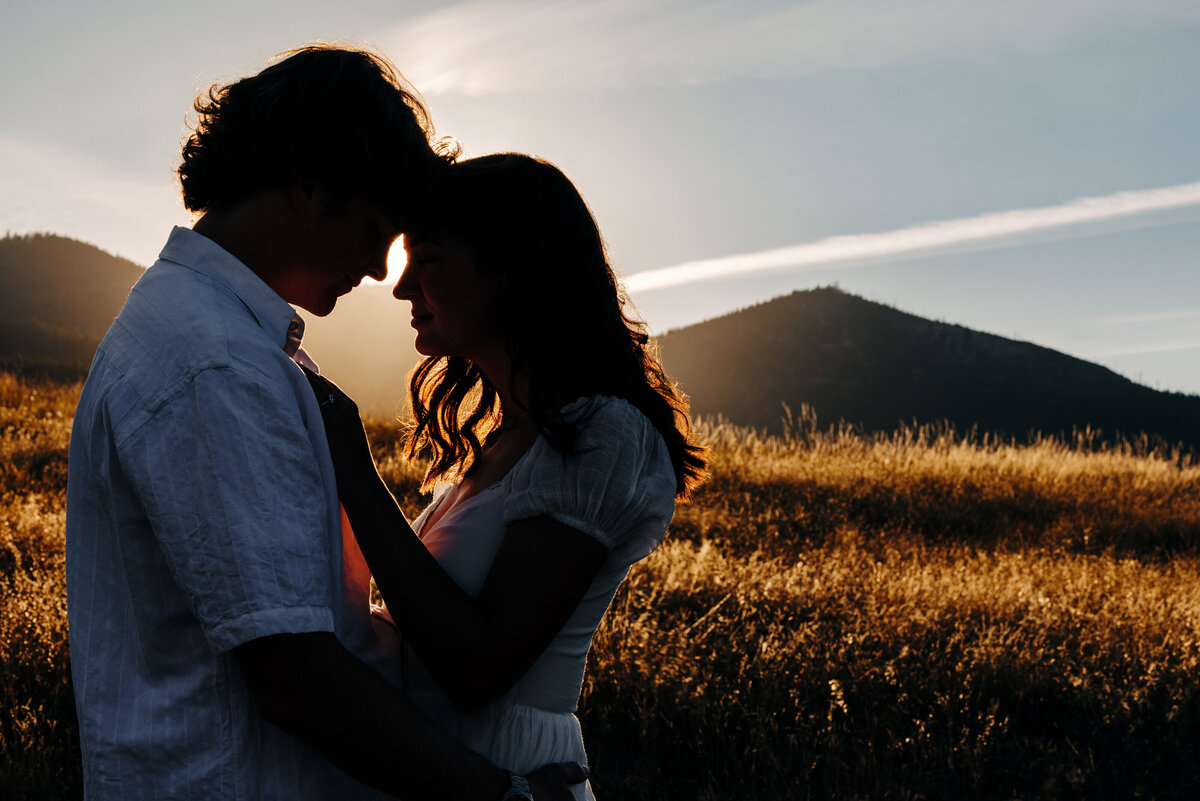 Silhouette of couple embracing at Blue Mountain in Missoula, MT
