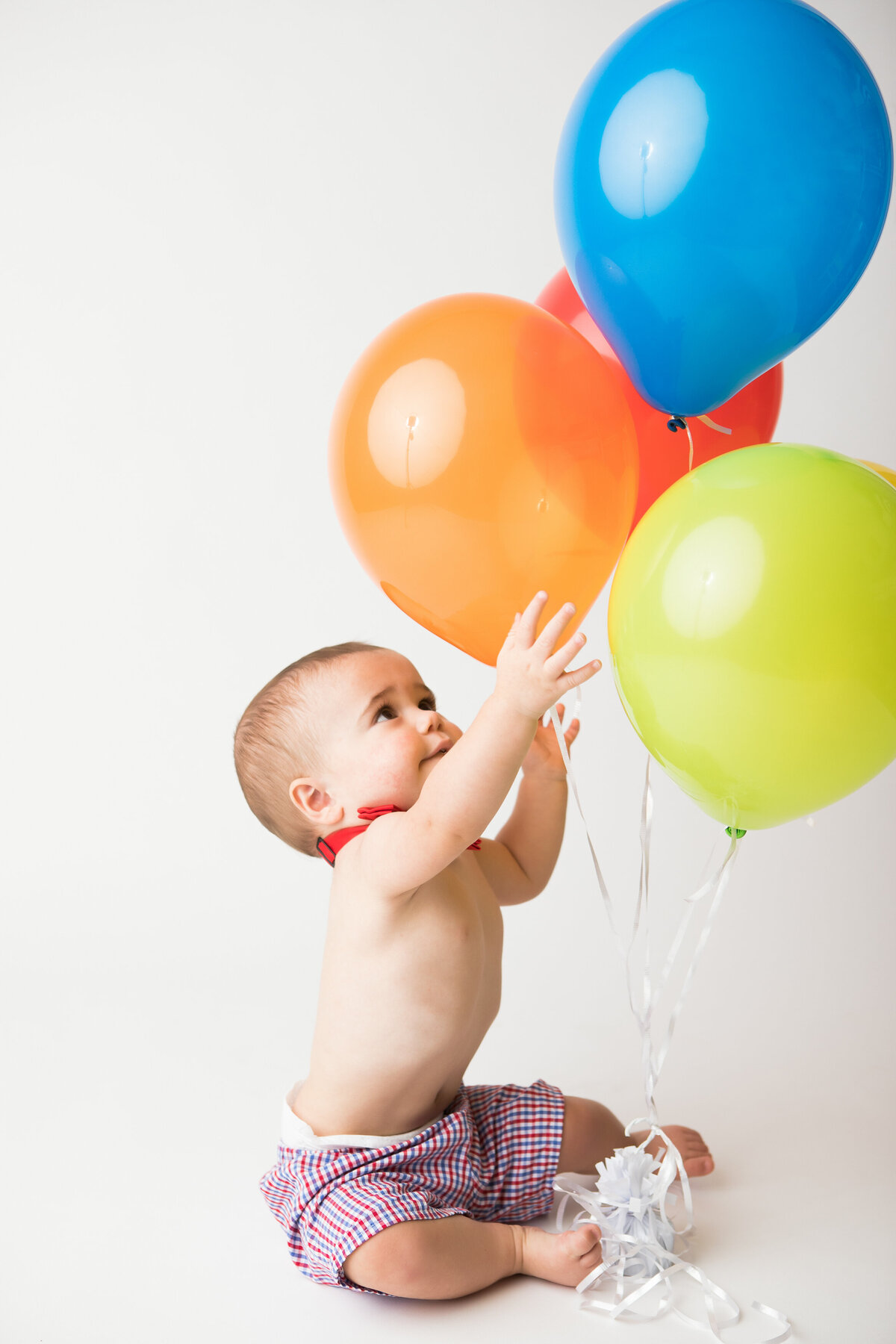 boy playing with balloons