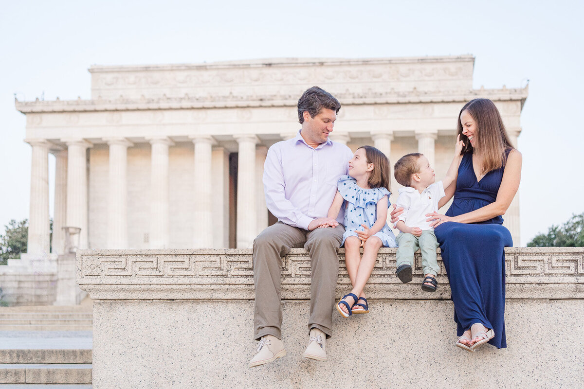 family of 4 laughing in their Washington, DC family photos