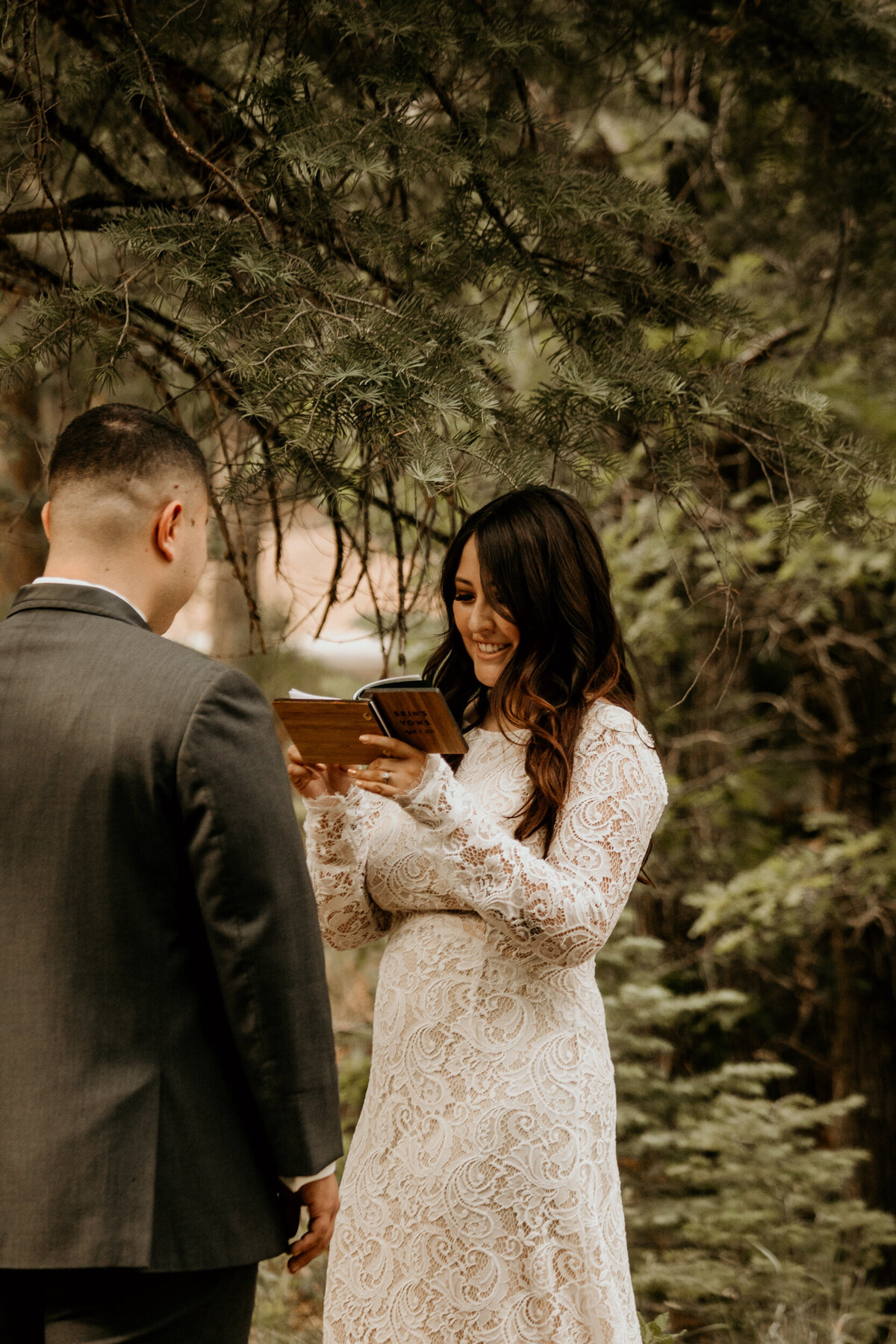 bride and groom exchanging private vows in the forest in Cedar Crest New Mexico