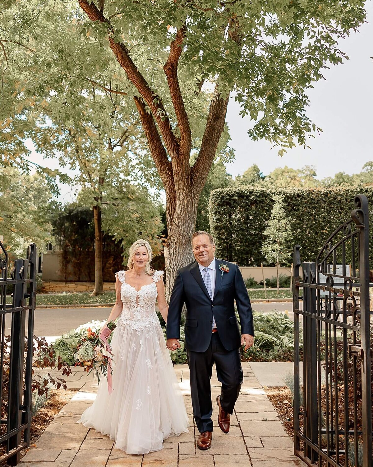 bride and groom walking and smiling