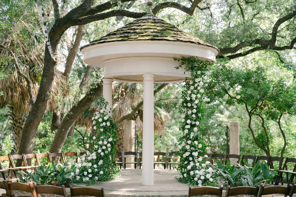 wedding ceremony altar in garden white flowers