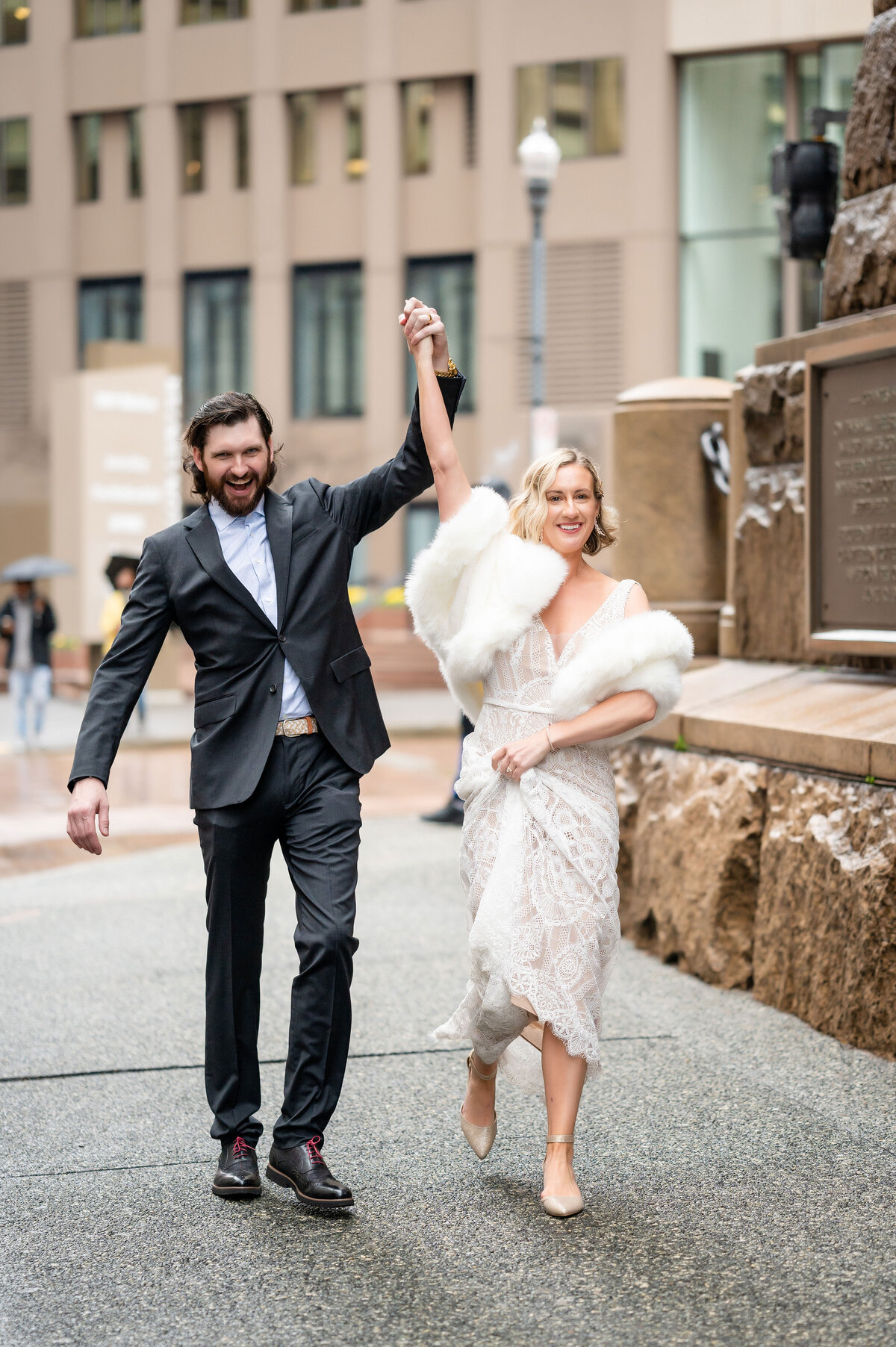 elopement couple walking pittsburgh downtown street in front of the allegheny county courthouse