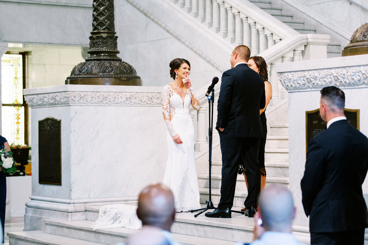 bride is laughing at the ceremony