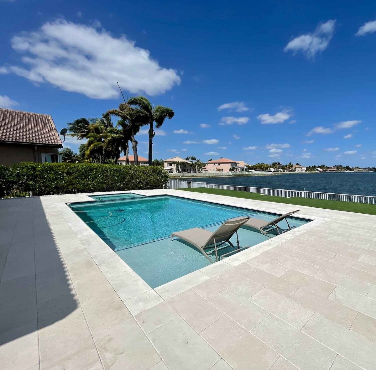 Swimming pool and spa with tanning ledge