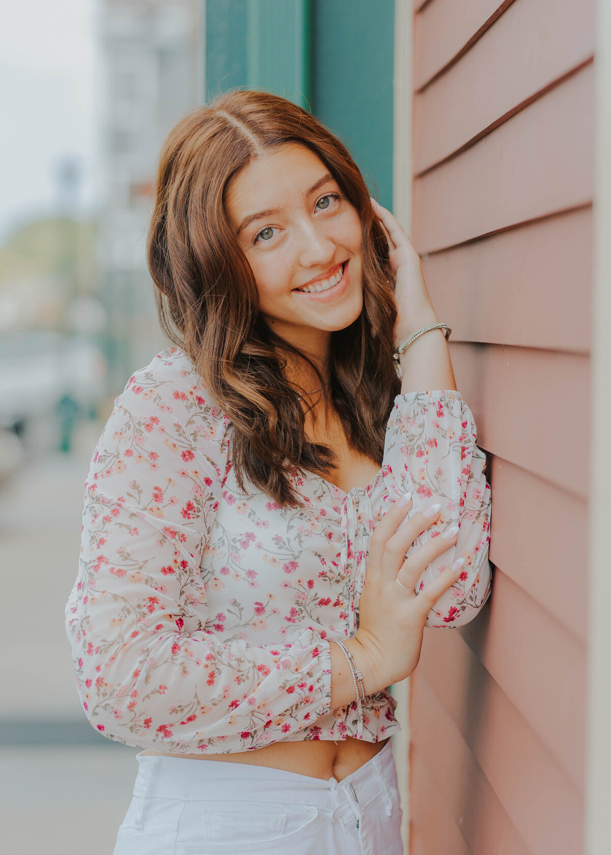 woman posing by wall