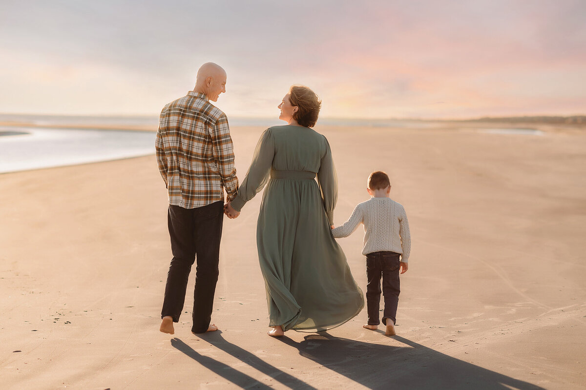 Family walks along the beach together during Family Photoshoot on Kiawah.