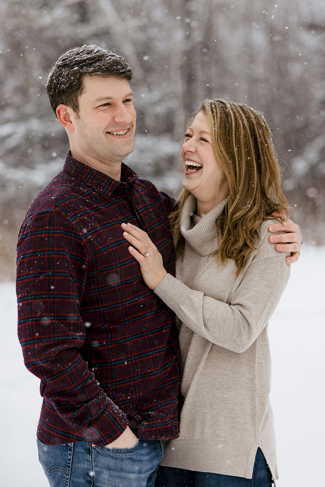 Black sand beach engagement photos in the snow