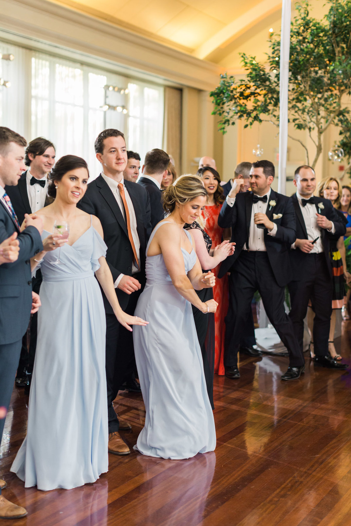 The party starts off quickly as the bride and groom are announced for their first dance. Photo by luxury destination wedding photographer Rebecca Cerasani.