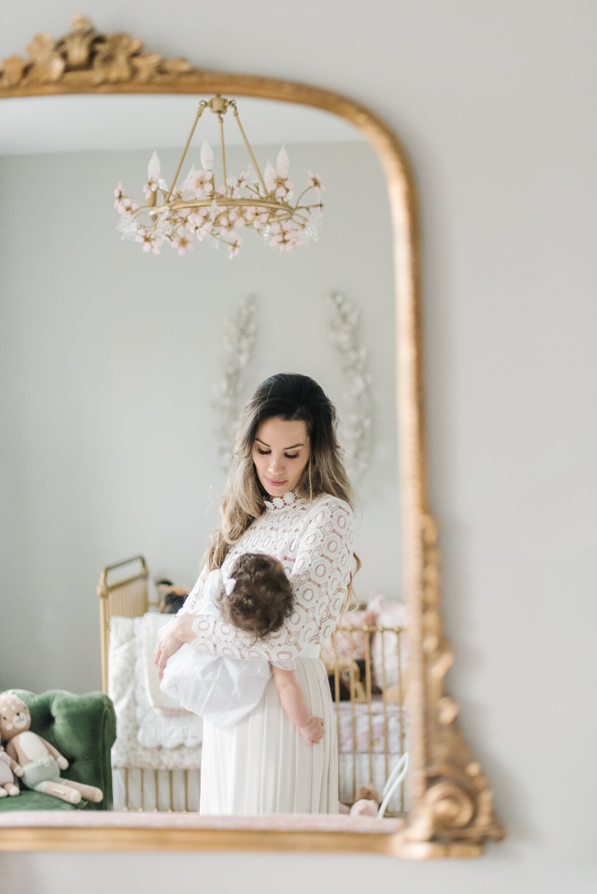 Mom holding baby reflected in gold mirror - Northern Virginia Newborn Photographer