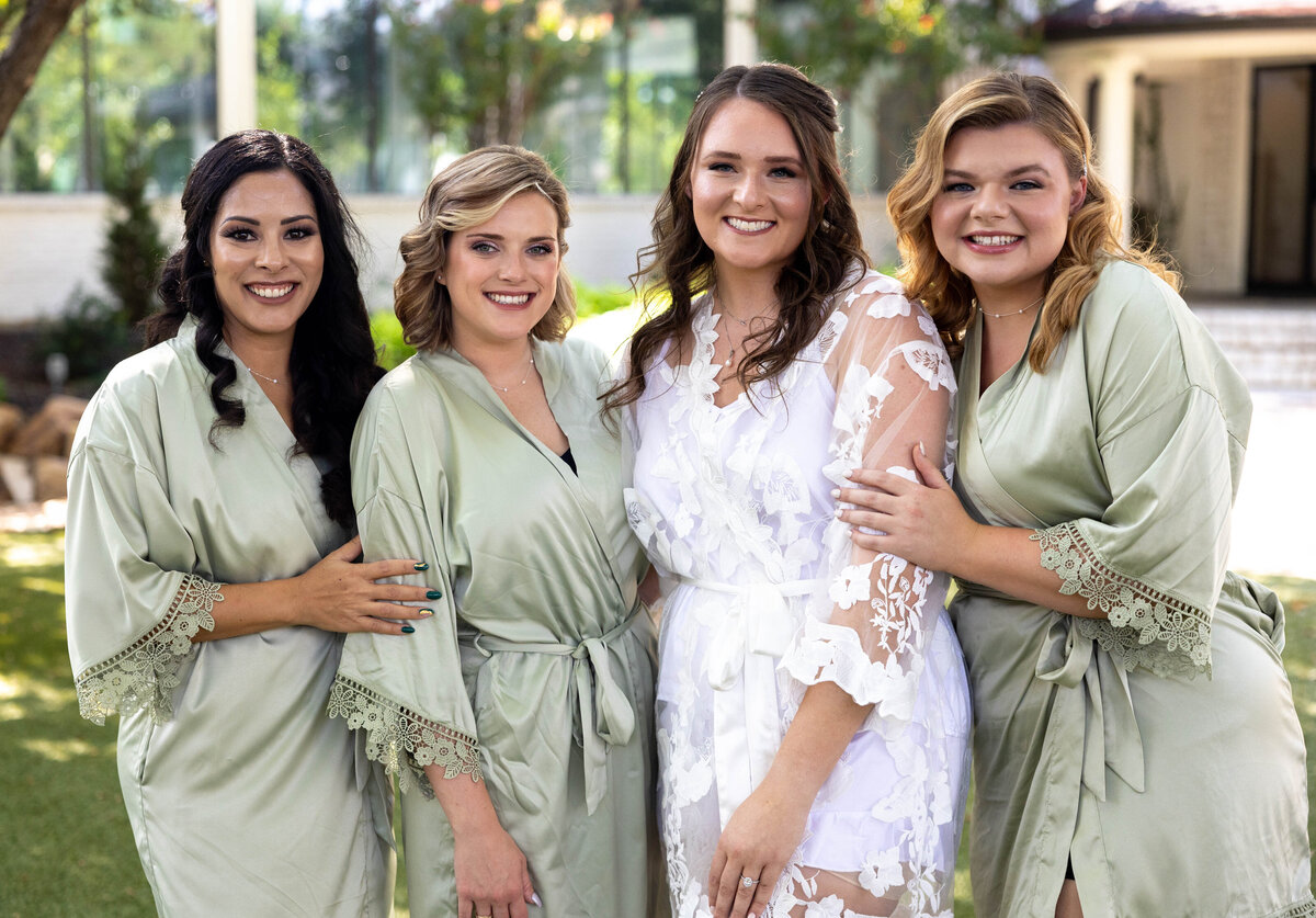 bride and bridesmaids in robes