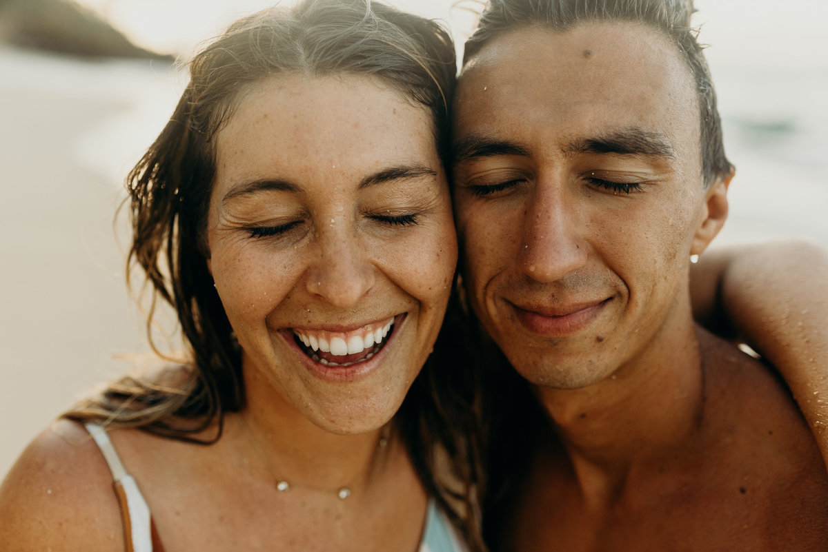 man & woman smiling