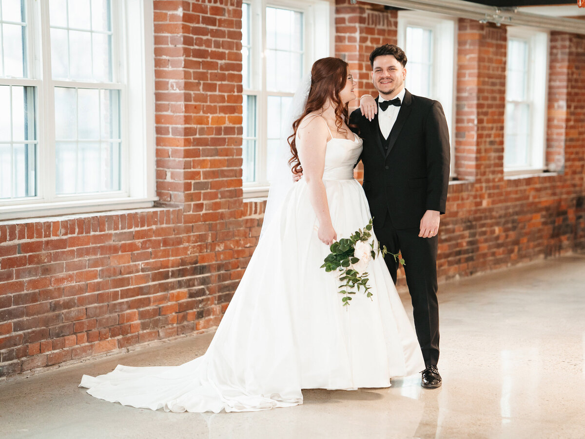 Industrial wedding photos at The Venues at the Factory featuring emotional portraits and unique architecture