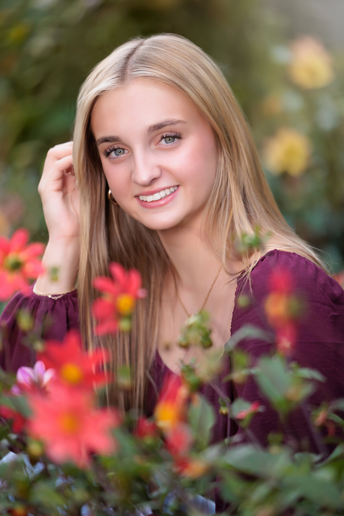 Raleigh Senior portraits sitting in flowers