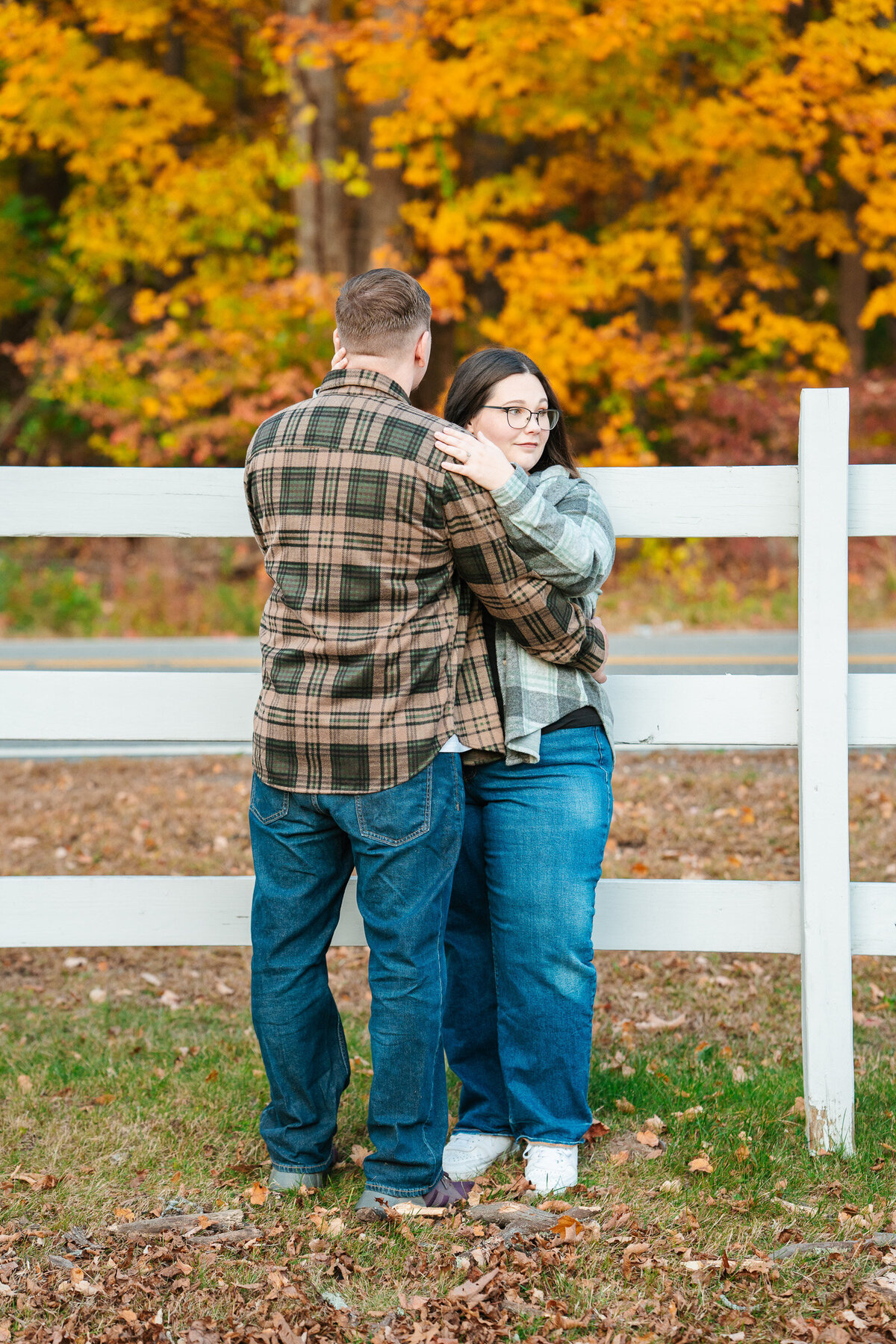 Candid New England fall engagement photography with emotional natural moments