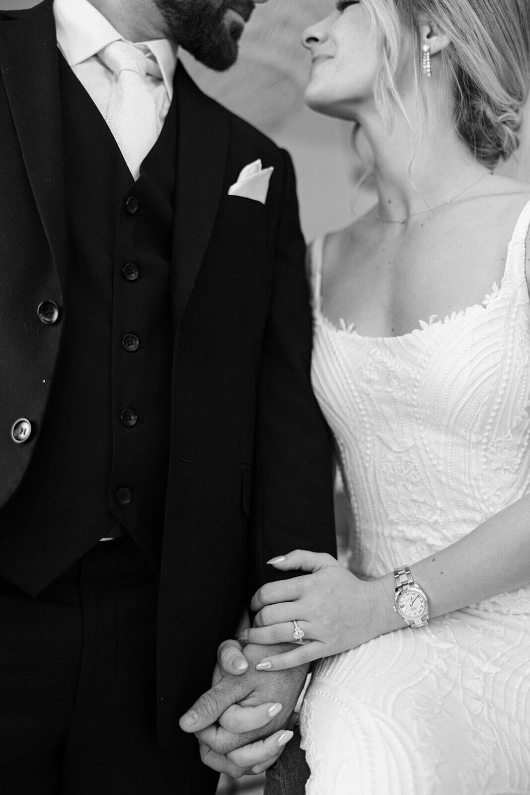 Bride and groom holding hands