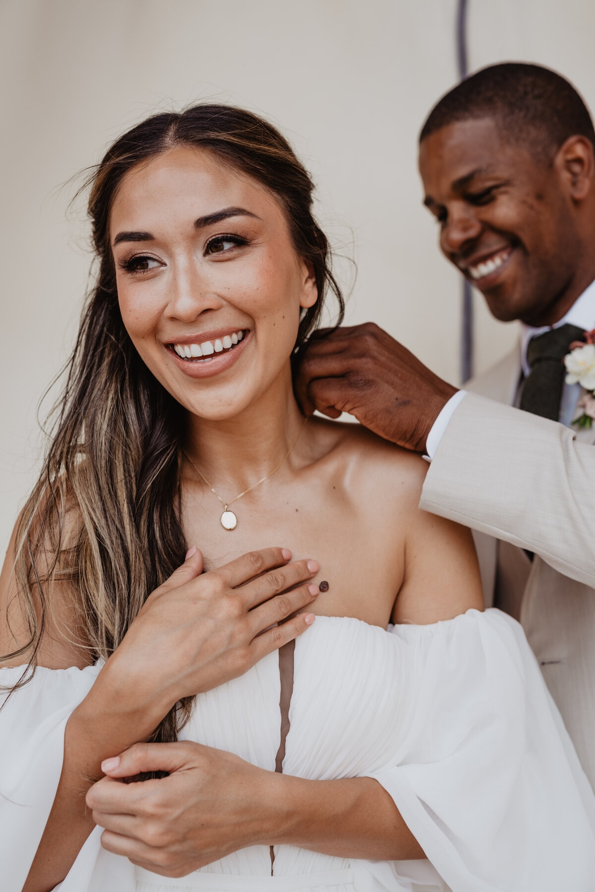 Utah Elopement Photographer captures woman smiling with necklace