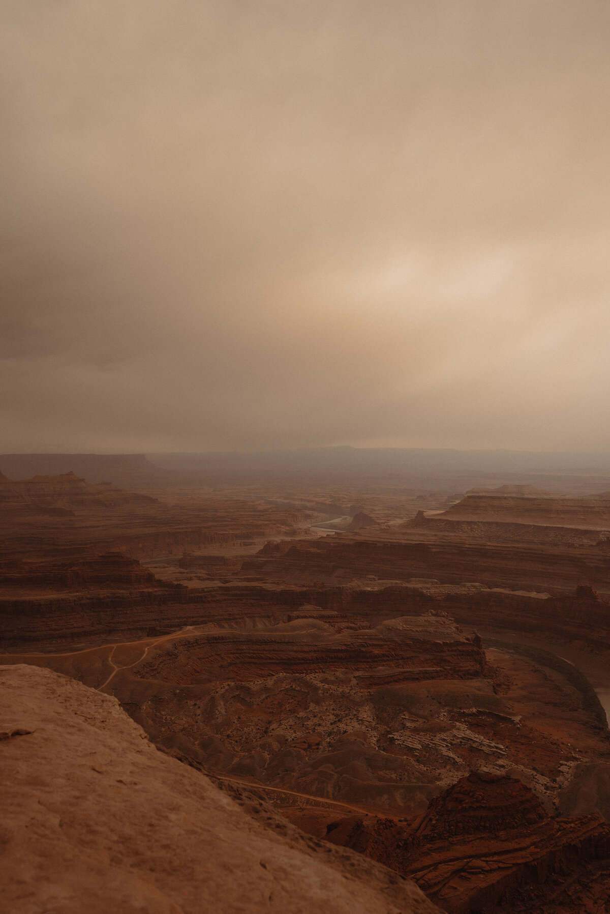 wild and scenic photo of Moab, Utah on a cloudy and moody day