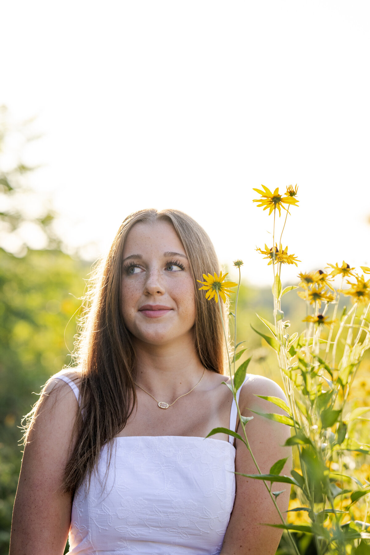 Golden hour senior portrait of Brownsburg high school student by Indianapolis photographer at Newfields gardens