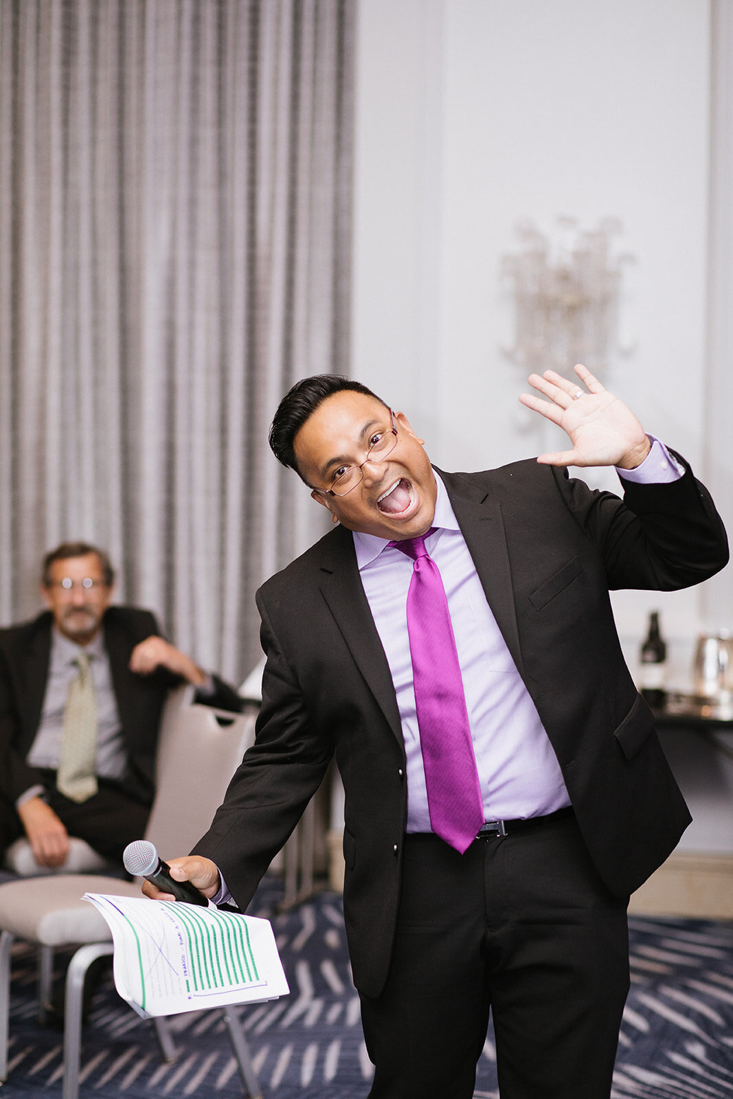 auctioneer waving at the camera