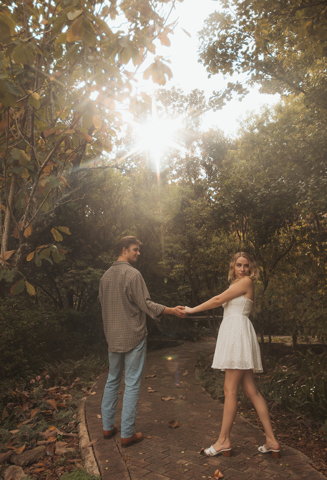 Couple holding hands during engagement photos in Georgia